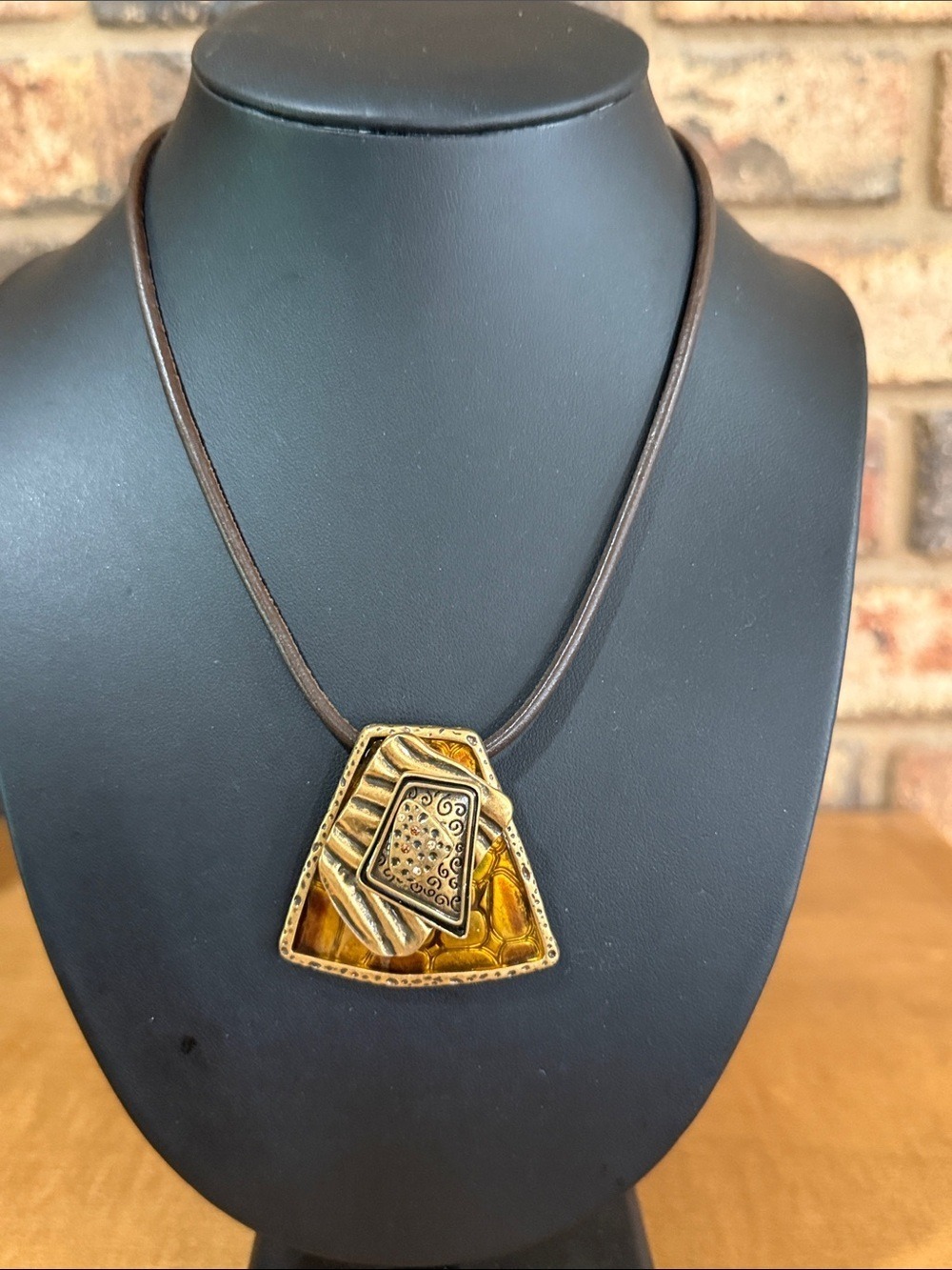 Chico’s Tribal Brown leather cord and gold tone pendant necklace